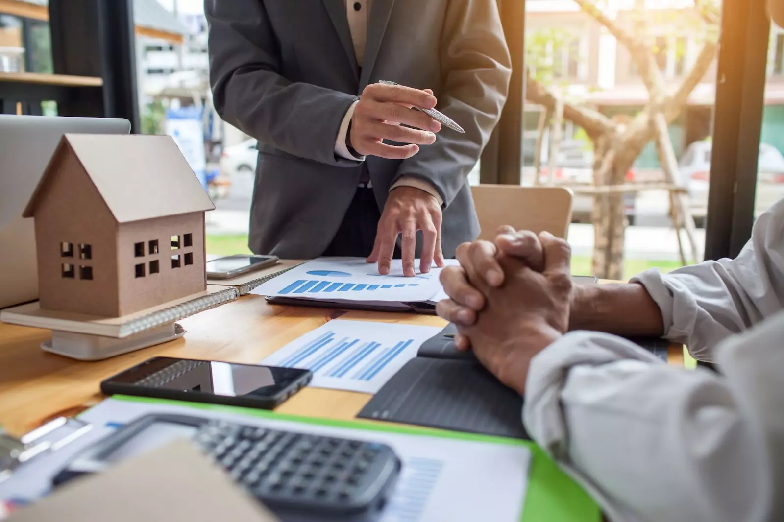 Business meeting discussing hard money lender underwriting tips.